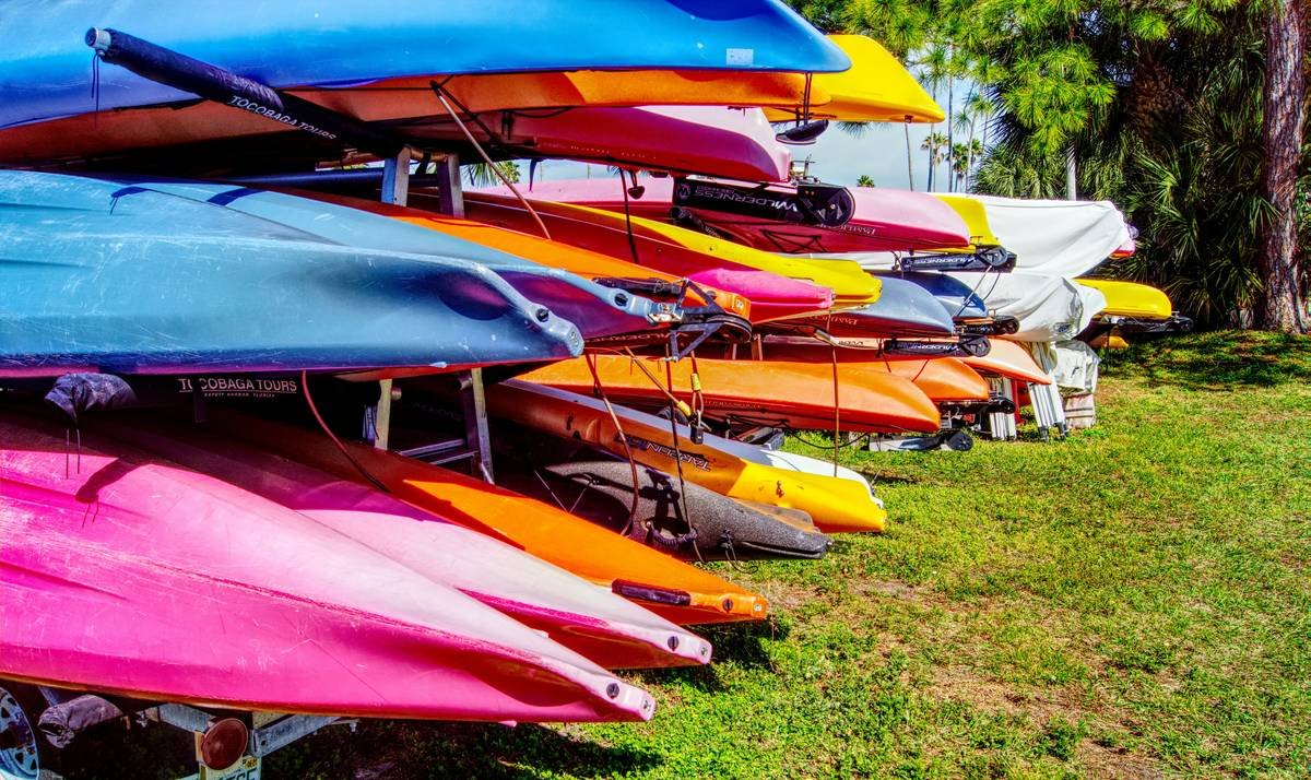 Infographic showing gap between standard home insurance limits and actual kayak replacement costs. Includes average kayak value ($800-$2,500), typical home policy exclusion thresholds, and claim frequency stats.