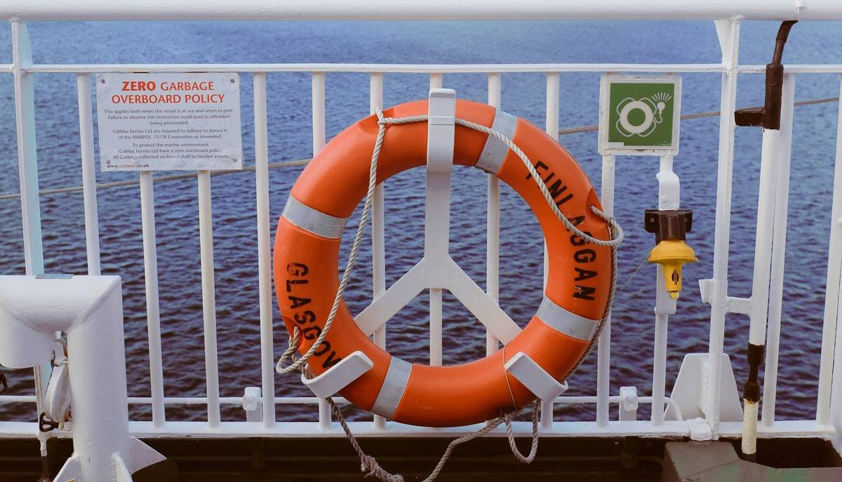 kayak rental operator reviewing types of pollution insurance documents on dock