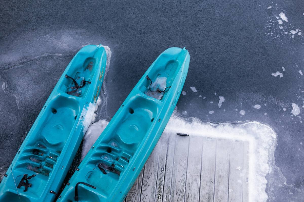 Kayaker reviewing accident without insurance costs after collision on lake