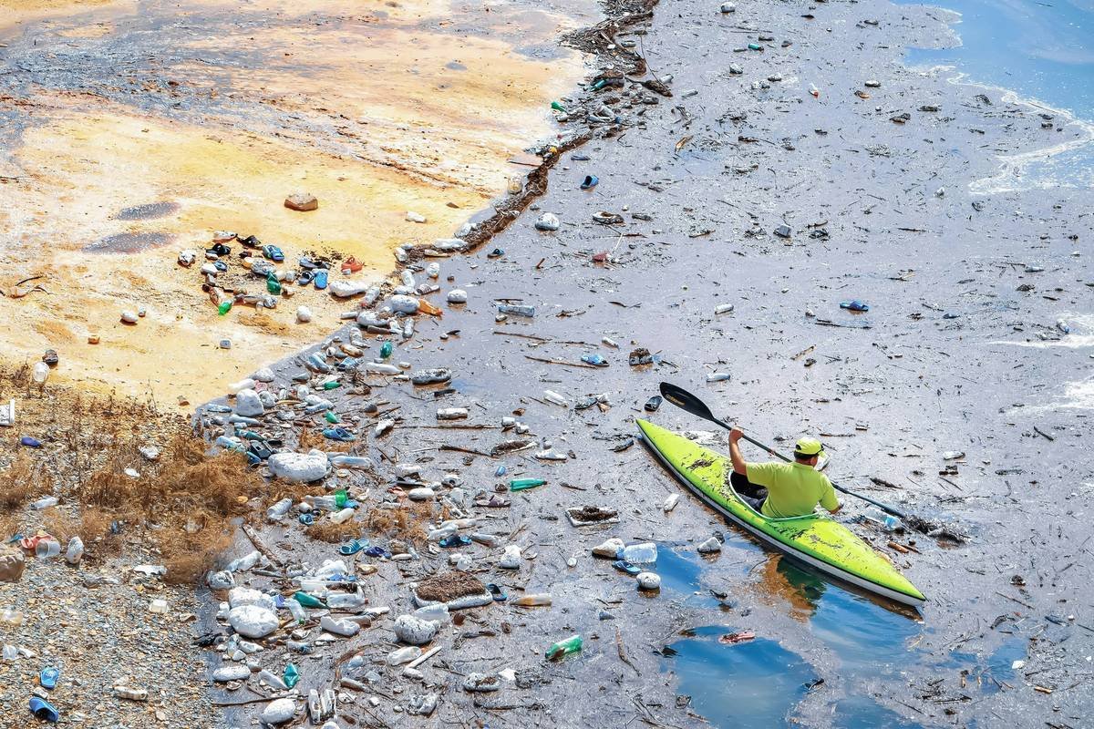 river guide showing types of pollution insurance certificate to kayaker before launch